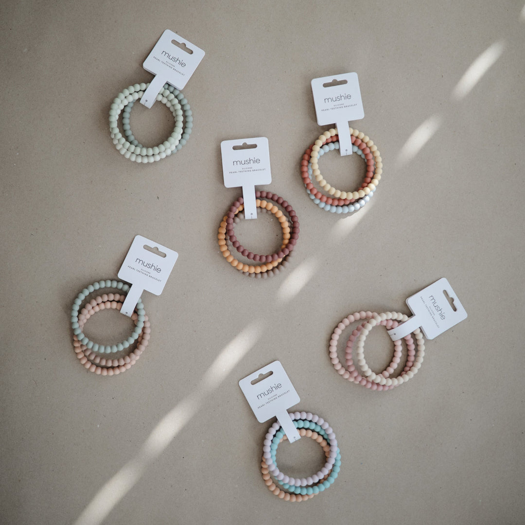 3 mordedores-pulseira pérolas Lilac/Cyan/Soft Peach Teether mushie