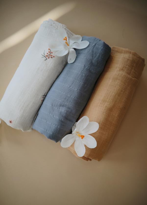 Muslin swaddle tradewinds mushie muslin mushie
