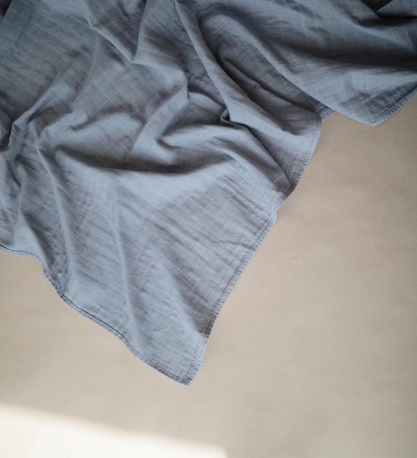 Muslin swaddle tradewinds mushie muslin mushie